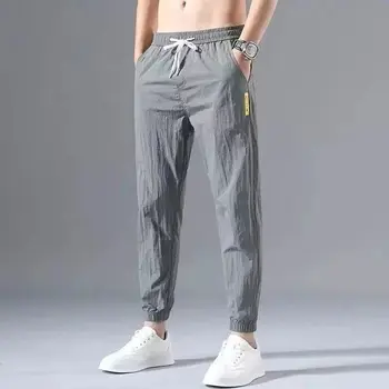 Летние Тонкие мужские повседневные брюки Ice Silk, Быстросохнущие Свободные шаровары, мужские спортивные брюки с 9 точками, плюс размер